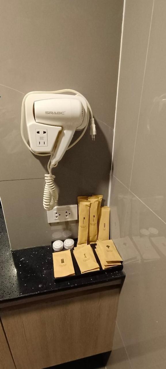 The Airport Courtyard Suvarnabhumi Airport Bangkok Exterior photo A hair dryer in a hotel bathroom