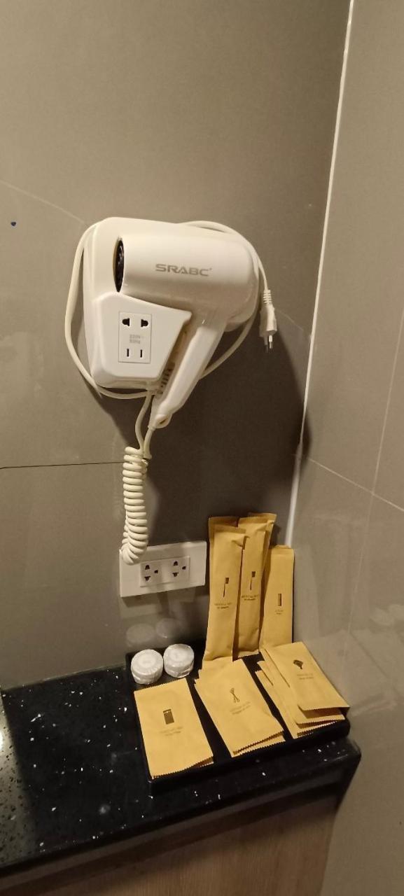 The Airport Courtyard Suvarnabhumi Airport Bangkok Exterior photo A hair dryer in a hotel bathroom